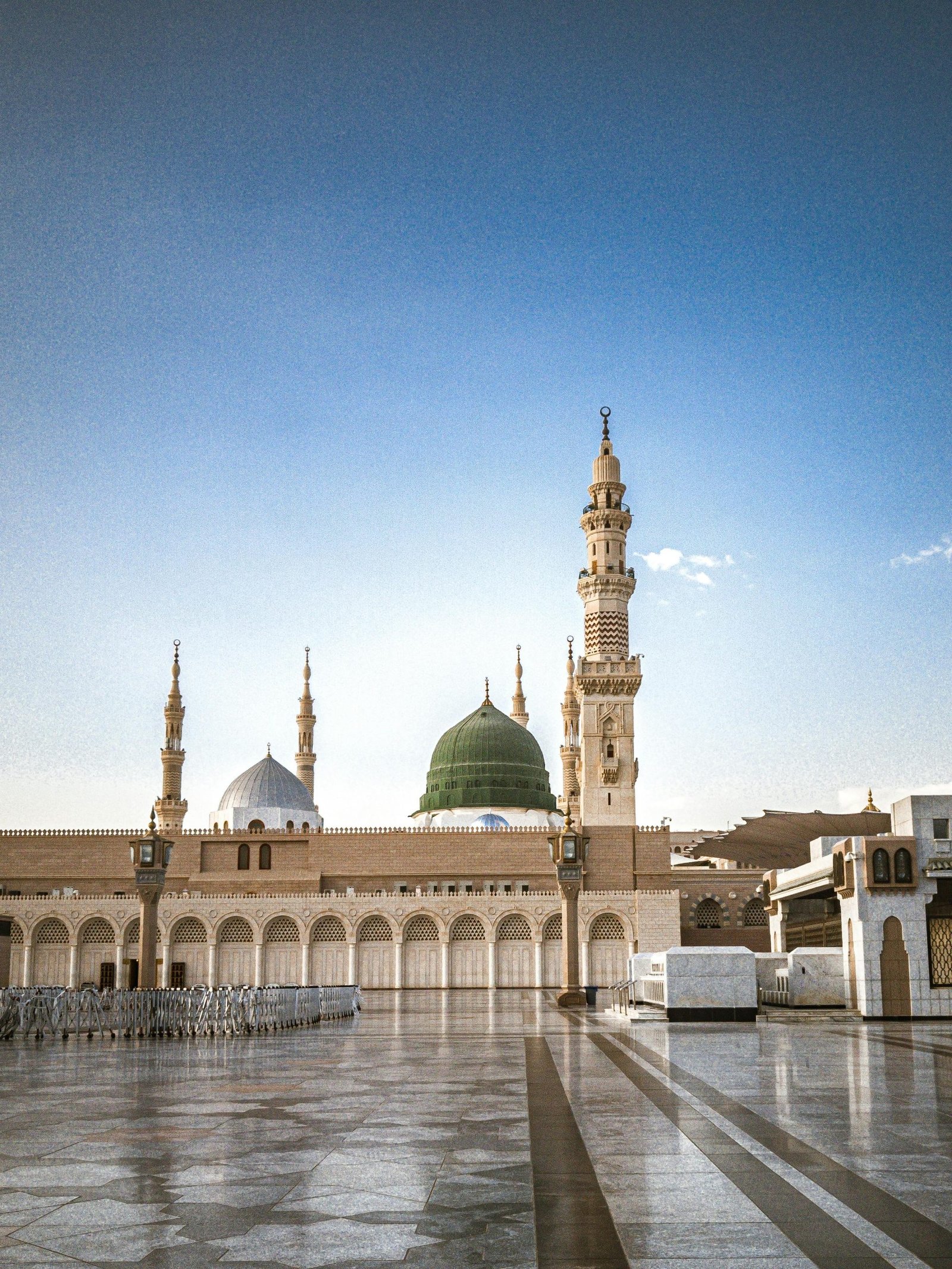 The Prophet's Mosque in Madinah with its iconic green dome, a significant Islamic landmark.